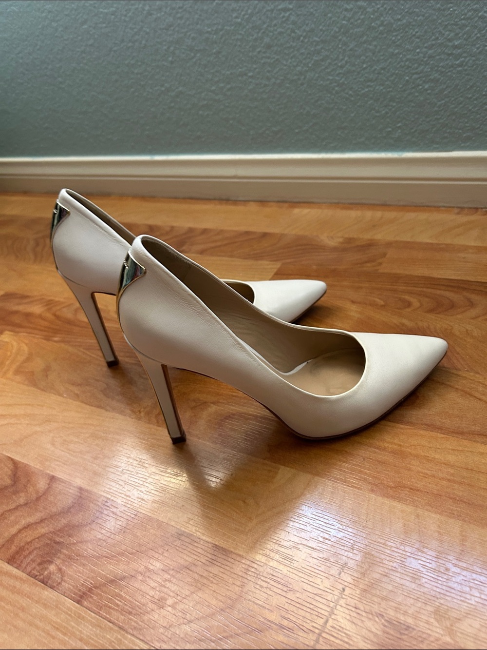 Marciano White Pointed-Toe Stiletto Pumps with Gold Accent